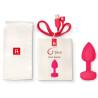 Gplug S rosa neón con la bolsa, el cable de carga y la guía de uso