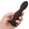 CalExotics Silicone Ribbed Anal Stud negro en la mano