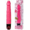 Vibrador rosa Baile junto a caja blanca con flores rosas y ventana transparente
