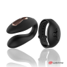 Dual Pleasure negro junto a su reloj