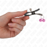 Pinzas Kink con doble campanilla rosa, una pinza sostenida con la mano