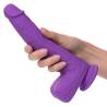 Rechargeable Gyrating & Thrusting Silicone Studs violeta en la mano