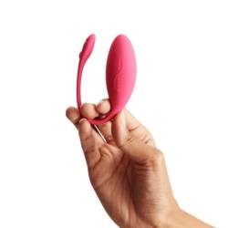 We-Vibe Jive rosa sostenido por el brazo de extracción