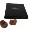 Edible Anus, caja negra y dos bombones de chocolate con leche