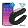 Satisfyer Double Joy negro junto a un móvil con la app