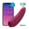 Satisfyer Curvy 1+ rojo junto a un móvil con la app