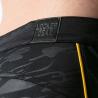 Detalle de cintura, camuflaje y distintivo del short Locker Gear
