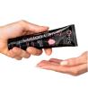 Manos sosteniendo el tubo Orgie Lube Tube Cotton Candy de 100 ml