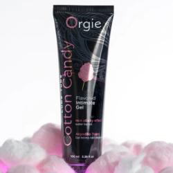 Gel Orgie Cotton Candy de 100 ml presentado entre algodones de azúcar rosas y blancos