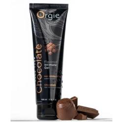 Gel Orgie Lube Tube Chocolate de 100 ml junto a bombones y trozos de chocolate