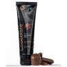 Gel Orgie Lube Tube Chocolate de 100 ml junto a bombones y trozos de chocolate