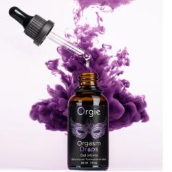 Orgie Orgasm Drops con cuentagotas abierto sobre una nube violeta decorativa