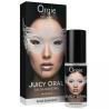 Frasco y caja de Orgie Juicy Oral con un rostro y antifaz plateado en el diseño