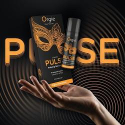 Frasco y caja Orgie Liquid Pulse sobre una mano en un montaje negro y naranja