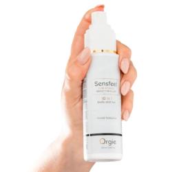 Pulverizador blanco de Orgie Sensfeel para mujer sostenido en la mano