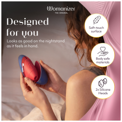 Womanizer Next Liberty azul y rojo en la mano